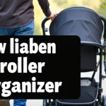 The image shows a multi-compartment organizer attached to a stroller handle, perfect for a Disney trip guide.