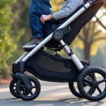 The image shows a clean, organized stroller with essential baby items neatly stored in a versatile organizer.